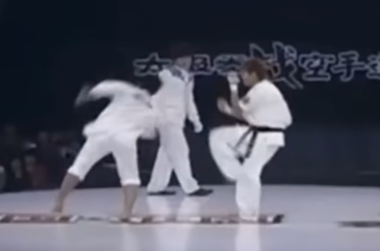 Tai Chi practitioner sets up another corkscrew kick