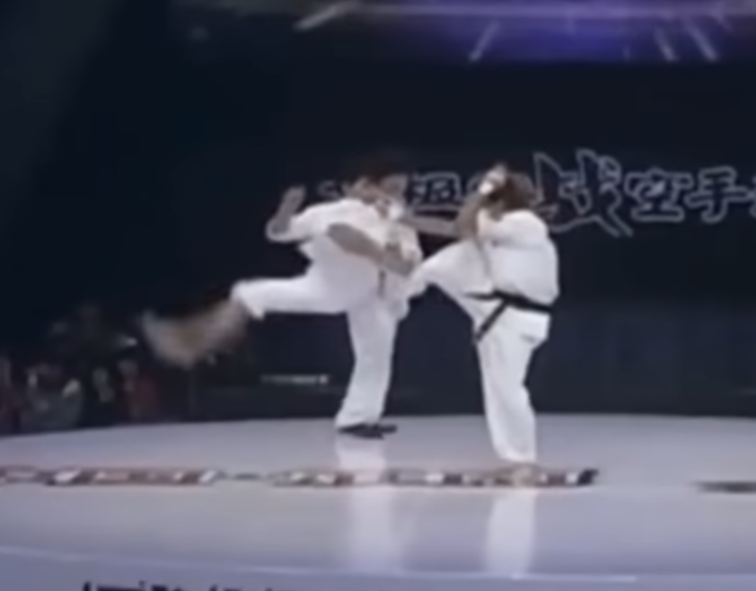 Tai Chi practitioner sets up another corkscrew kick