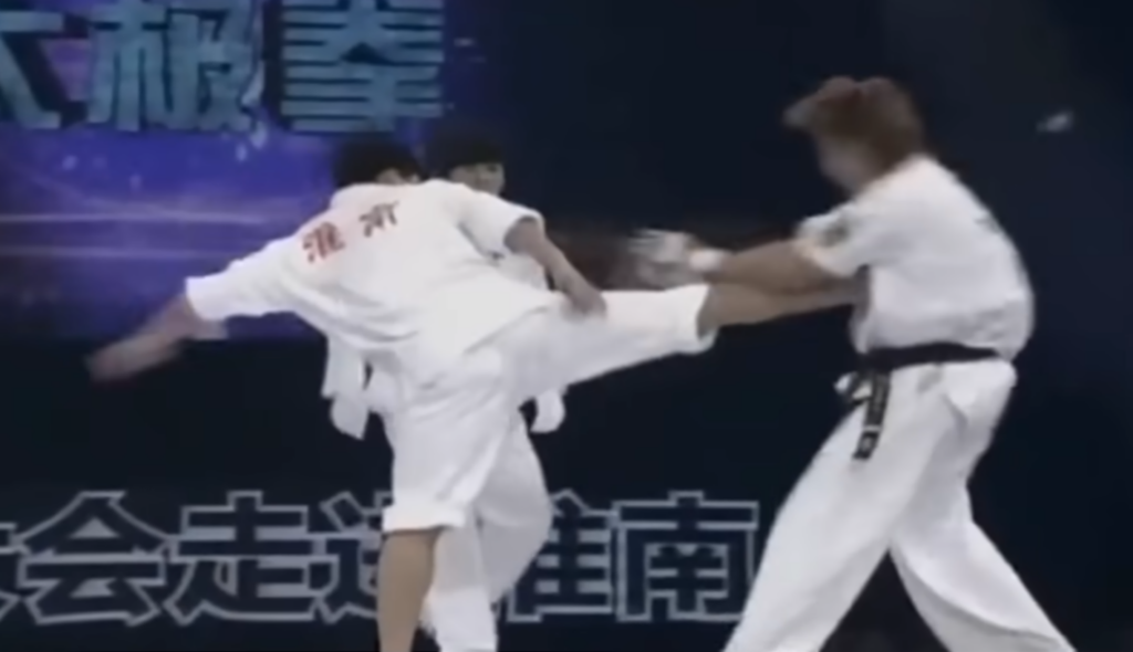 Tai Chi practitioner sets up another side kick
