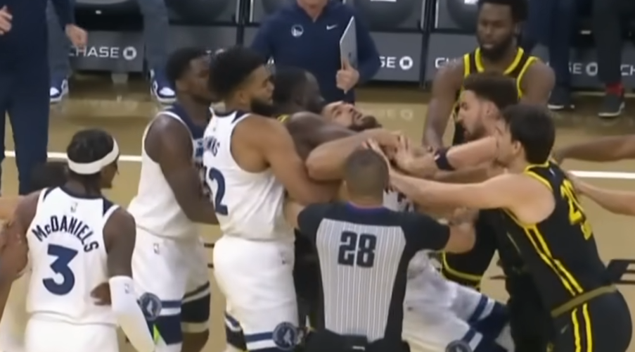 NBA player Rudy Gobert dragged by Draymond Green while in a chokehold.
