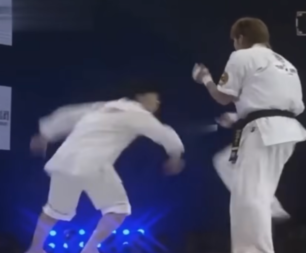 Tai Chi practitioner sets up a corkscrew kick