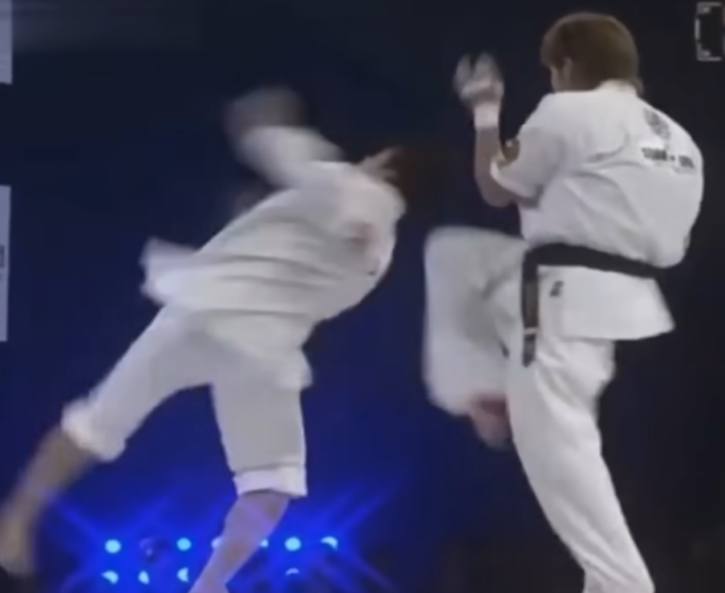 Tai Chi practitioner sets up a corkscrew kick