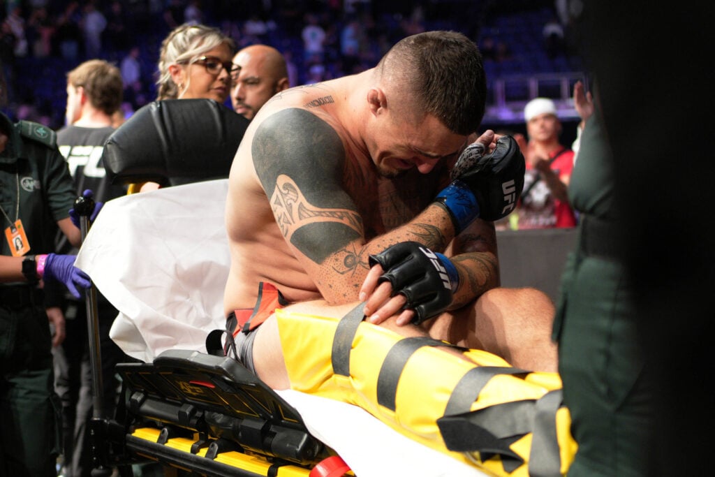 July 23, 2022, Greenwich, London, London, UK, United Kingdom: LONDON, UK - JULY 23: Tom Aspinall leaves the octagon on a stretcher after suffer a serious knee injury during his fight against Curtis Blaydes in their Heavyweight bout during the UFC Fight Night: Blaydes v Aspinall event at The O2 Arena on July 23, 2022, in Greenwich, London, United Kingdom. Greenwich, London United Kingdom -