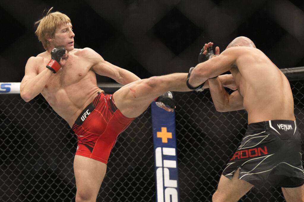 December 10, 2022, Las Vegas, Nevada, Las Vegas, NV, United States: LAS VEGAS, NV - DECEMBER 10: (L-R) Paddy Pimblett kicks Jared Gordon in their Lightweight fight during the UFC 282 event at T-Mobile Arena on December 10, 2022 in Las Vegas, Nevada, United States. Las Vegas, Nevada United States - ZUMAp175 20221210_zsa_p175_178