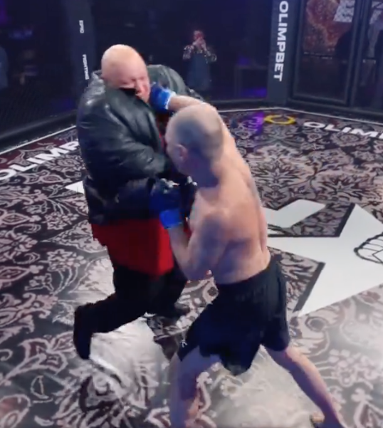 Russian bloger Oleg "Mongol" Perekhozhev fights a large opponent at Epic Fighting, landing another solid right hand and dropping his opponent