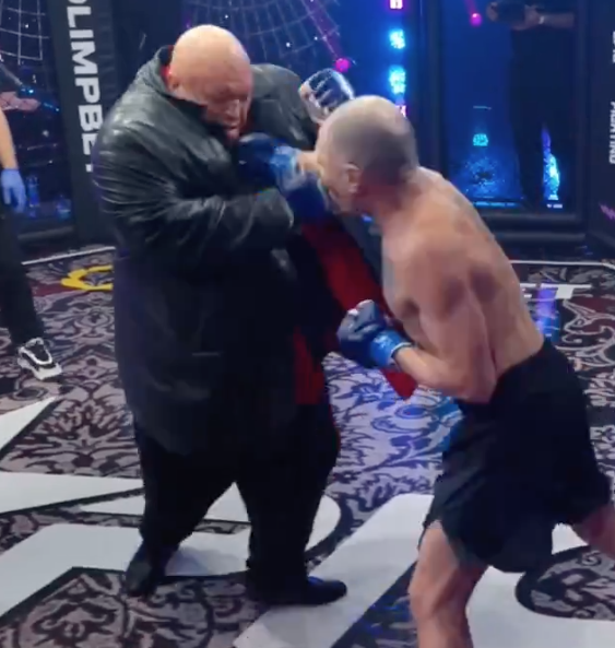 Russian bloger Oleg "Mongol" Perekhozhev fights a large opponent at Epic Fighting, landing a good right hand to the chin.