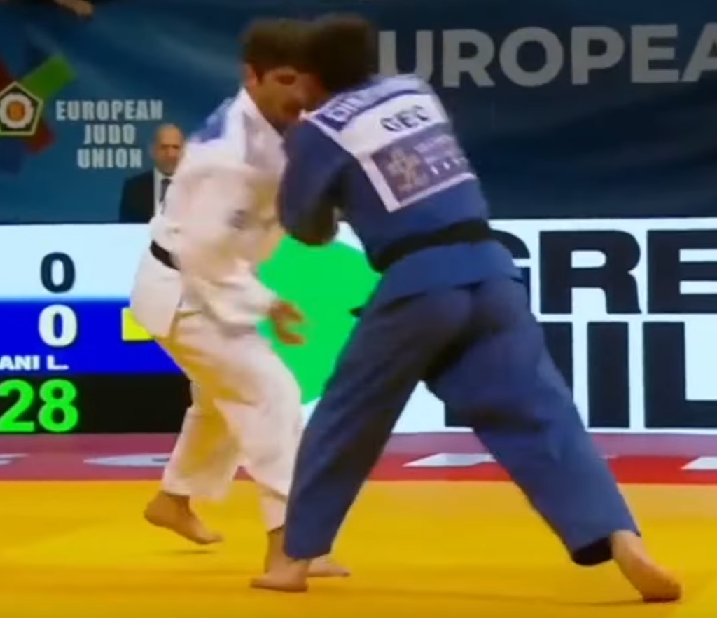 Judoka goes for collar grab in competition, ends up punching opponent and getting a knockout - alternate angle.