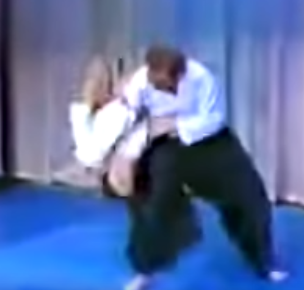 Steven Seagal on the Merv Griffin show in 1982, following through on lariat takedown.