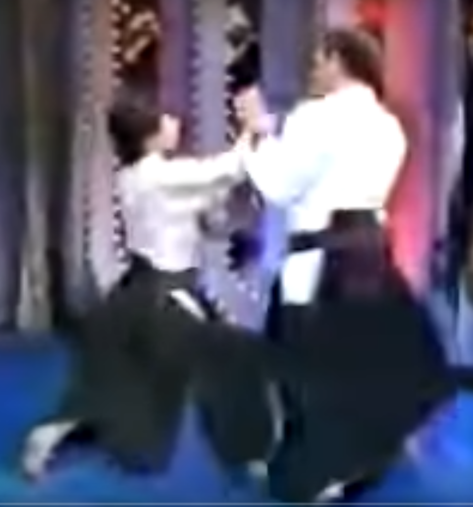 Steven Seagal on the Merv Griffin show in 1982, parrying a hand strike.