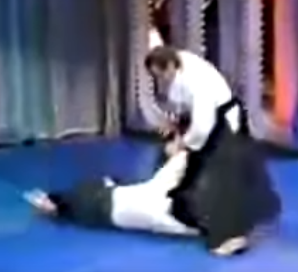 Steven Seagal on the Merv Griffin show in 1982, controlling opponent on the ground by his wrist.