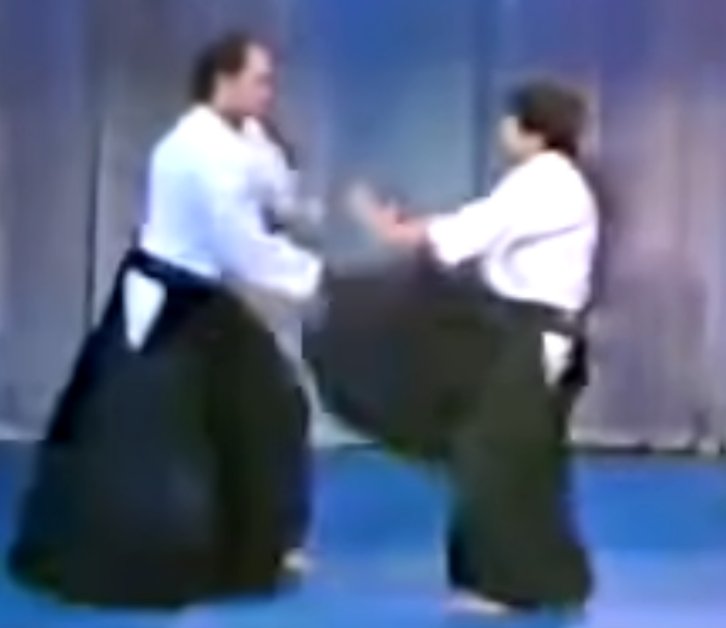Steven Seagal on the Merv Griffin show in 1982, parrying another kick.