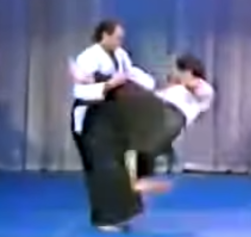 Steven Seagal on the Merv Griffin show in 1982, sweeping the leg of a training partner during demonstration.