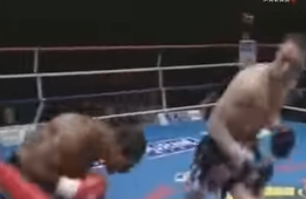Kickboxer Stanley Nandex ducks away from opponent.