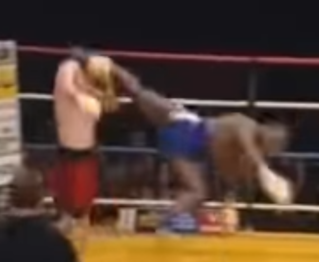 Kickboxer Stanley Nandex lands a lovely spinning heel kick during a match.