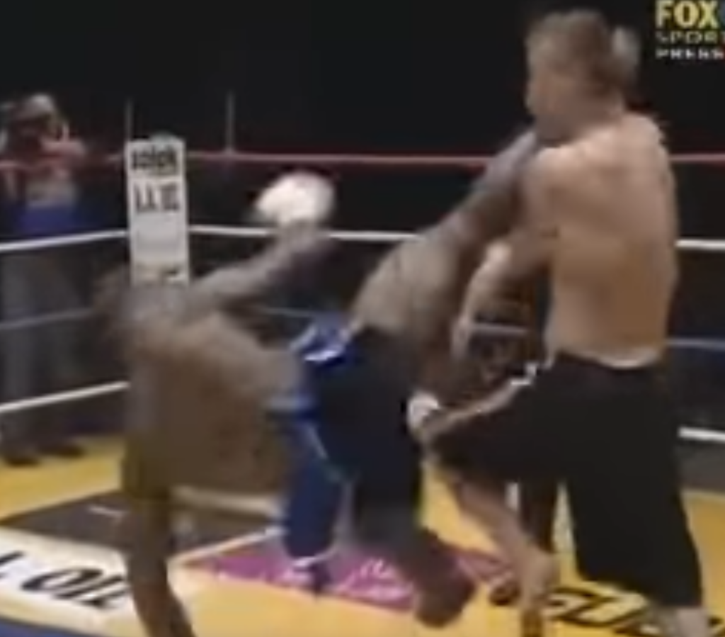 Kickboxer Stanley Nandex connects with a jumping spinning heel kick to his opponent's head.