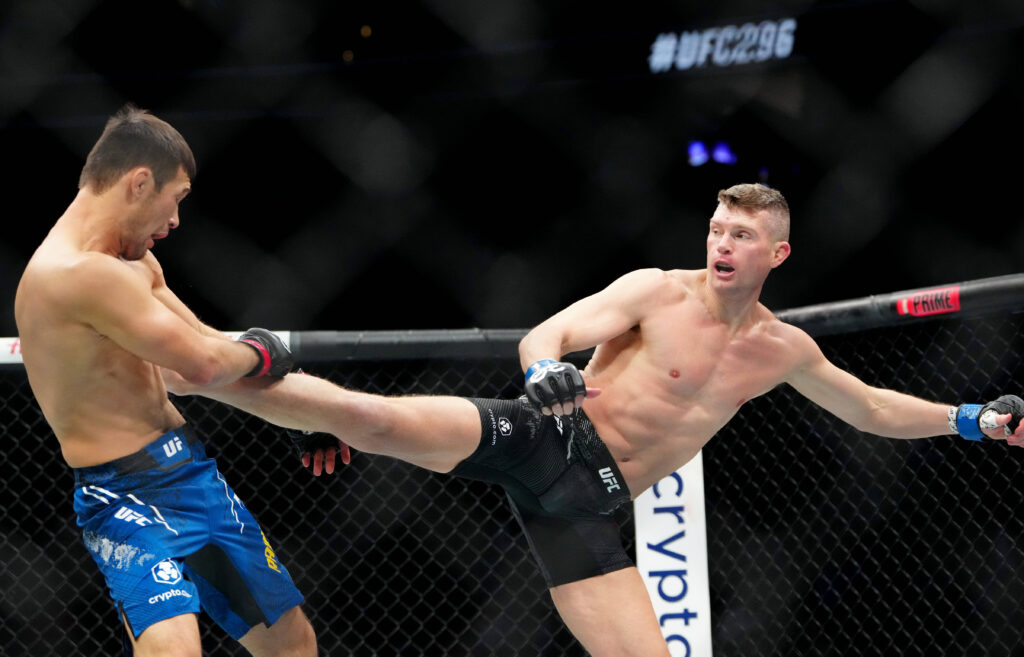Shavkat Rakhmonov (red gloves) fights Stephen Thompson (blue gloves) during UFC 296 at T-Mobile Arena.