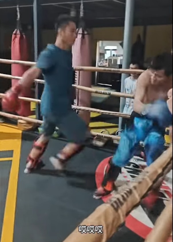 Kung Fu master shells up in corner as opponent loads up another big looping punch.