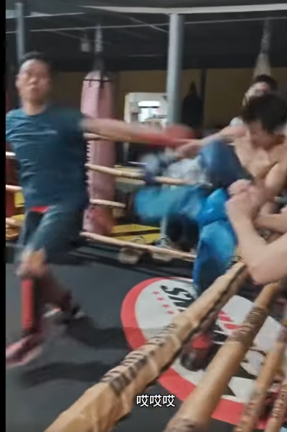Kung Fu master winces as he dodges a spinning backfist