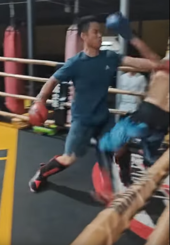 Kung Fu master is off-balanced by opponent. 