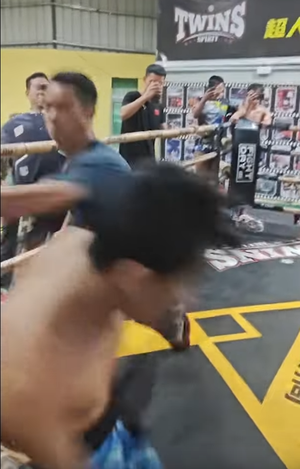 Kung Fu master dodges a big whiffing punch from opponent