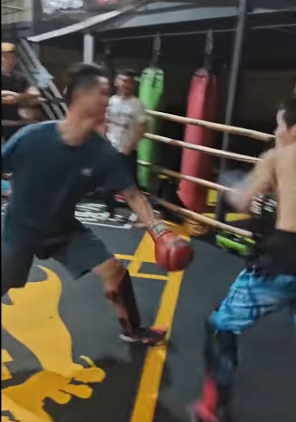 Kung Fu master braces for impact as opponent loads up a big wide punch