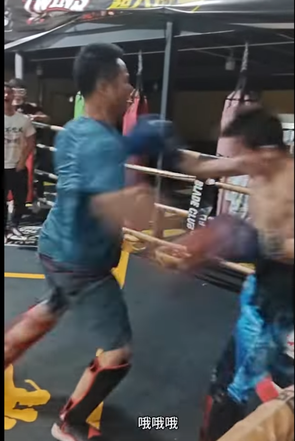 Kung Fu master is about to get struck by opponent, whose arm is mid-punch