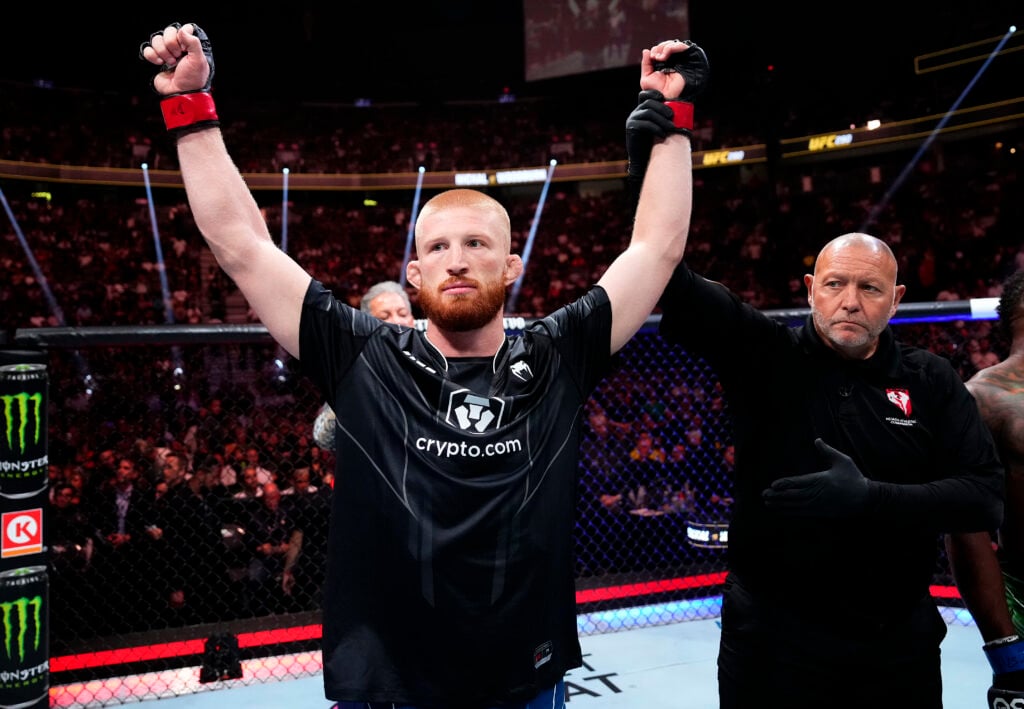 Bo Nickal celebrates after beating Val Woodburn at UFC 290