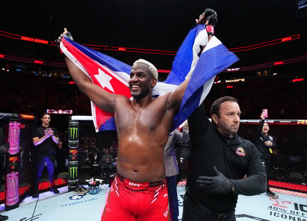 Robelis Despaigne celebrates with the Cuban flag after winning his UFC 299 debut