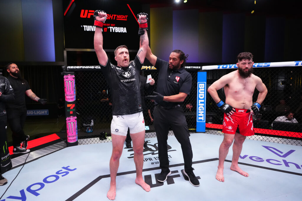 (L-R) Gerald Meerschaert reacts after his submission victory over Bryan Barberena in their middleweight fight during the UFC Fight Night event at U...